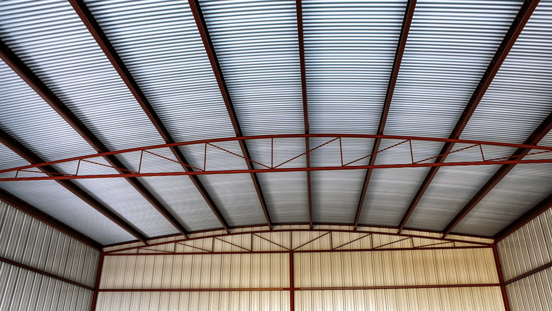 Interior view of industrial roof structure with exposed steel beams, corrugated polycarbonate panels, and metal framework.